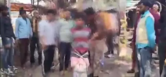 A 10-year-old boy in Khurja, UP, was tied to a tree and beaten on theft allegations. Police rescued the child and shifted him for medical care.