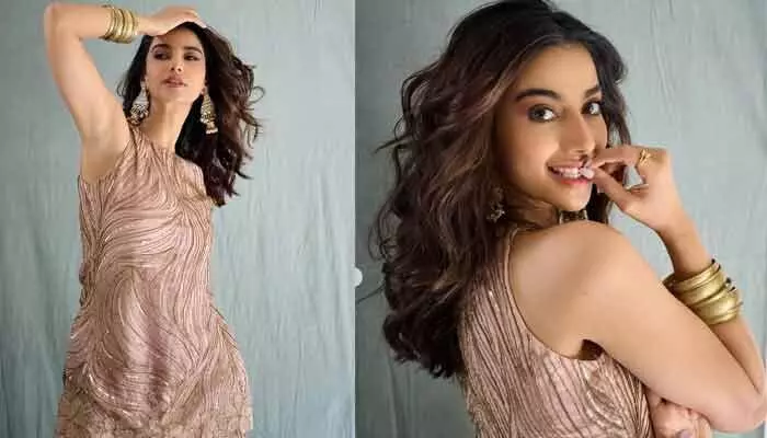 Meenakshi Chaudhary shares stunning photos in gold ornaments and a cute dress, mesmerizing fans on Instagram.