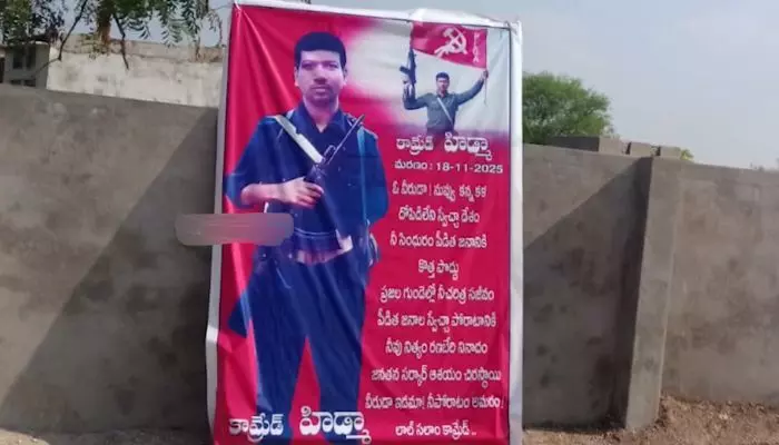Police register case against two individuals for putting up a tribute flex to Maoist leader Hidma in Warangal district.