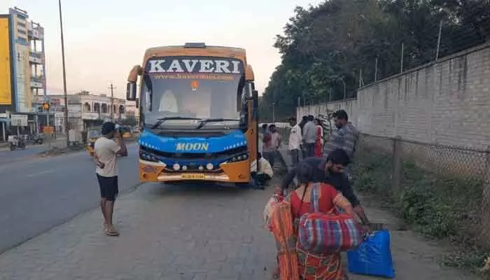 A travel bus from Bhadrachalam to Bengaluru filled with smoke, causing passengers to panic. The driver stopped the bus and everyone evacuated safely.