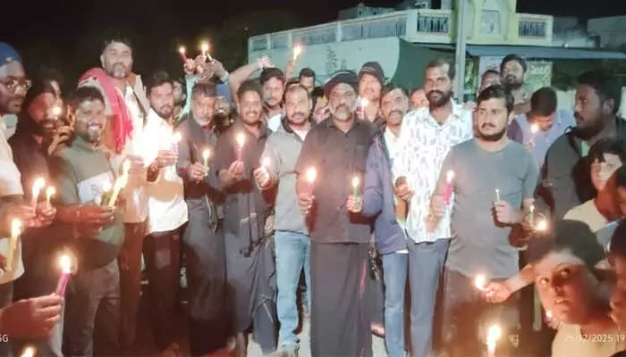 Youth in Tandriyala village held a candlelight rally condemning the repeated attacks on Hindus in Bangladesh.